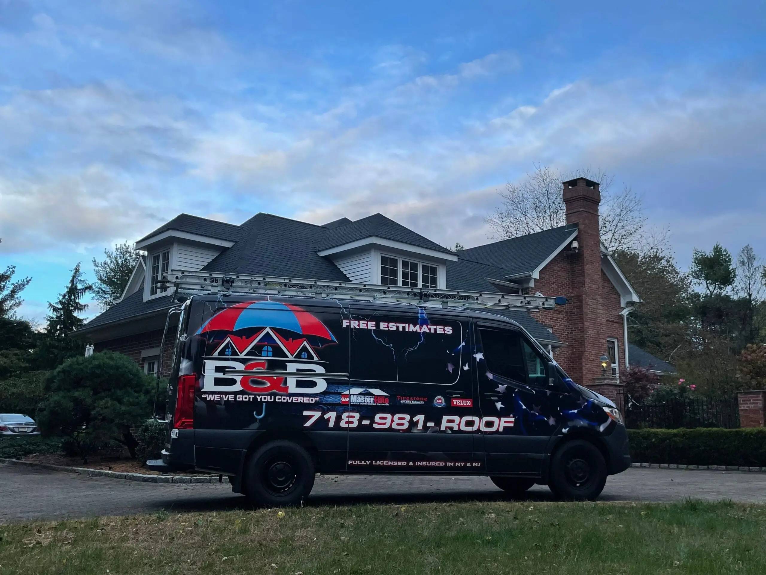 B&B Roofing van parked outside a brick home with a new roof in New Jersey