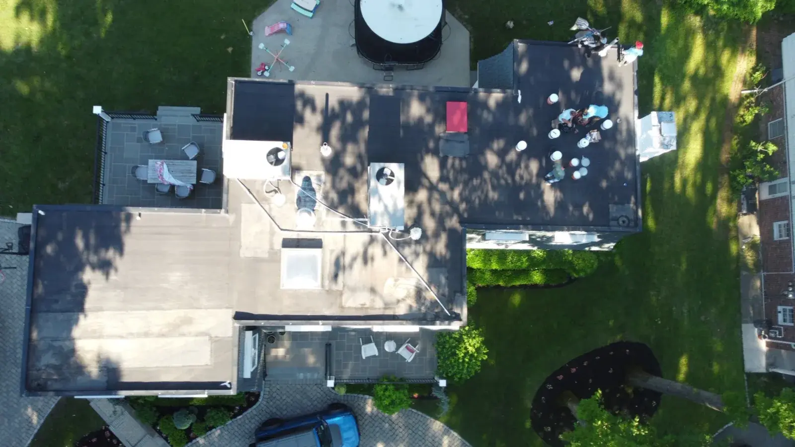 Before: Flat roof coating in Stapleton