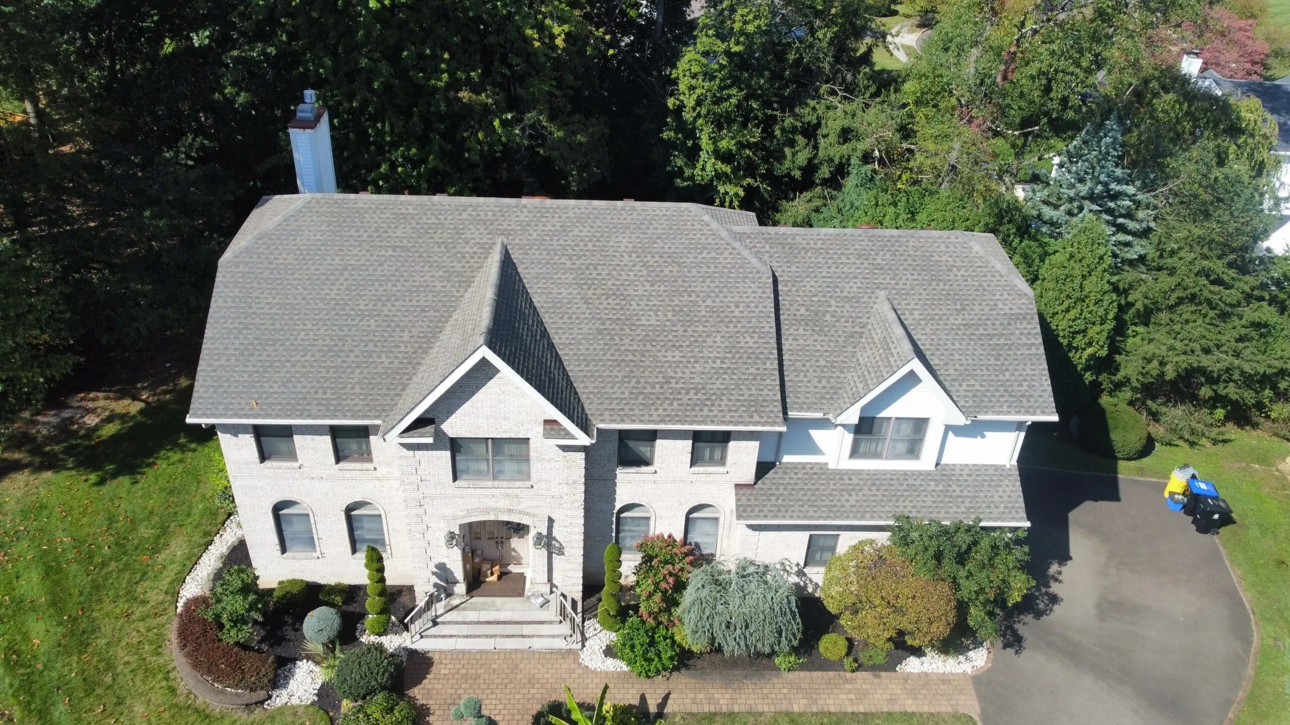 Drone photo of a home in East Brunswick, NJ, with a new shingle roof