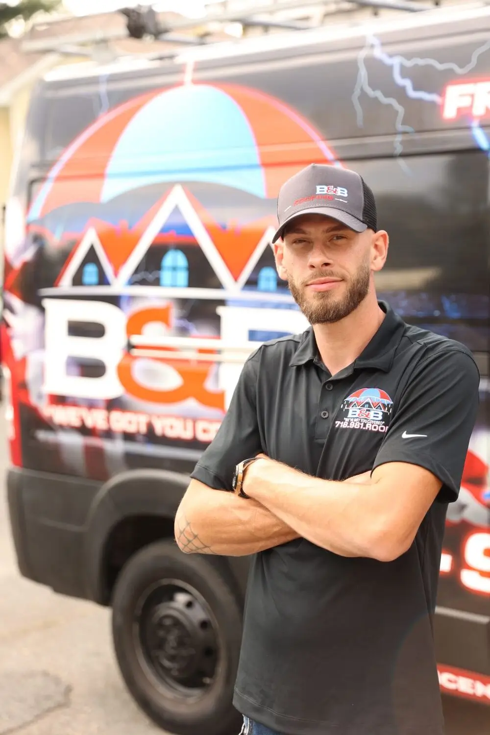 Bill, co-owner of B&B Roofing, in front of a B&B truck