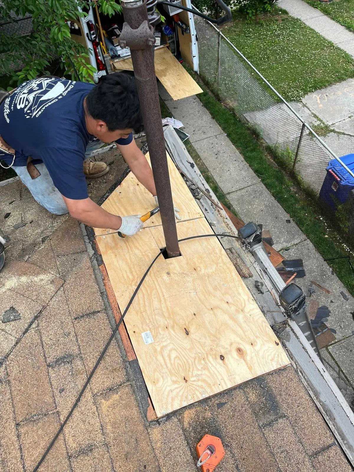 New plywood patch installed in the roof deck around a vent pipe